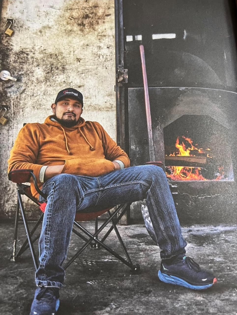 man in front of bbq smoker