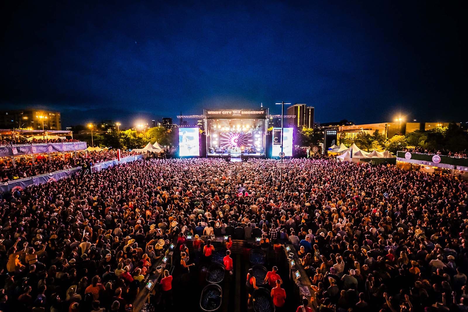 wide shot just above the crowd looking toward the stage