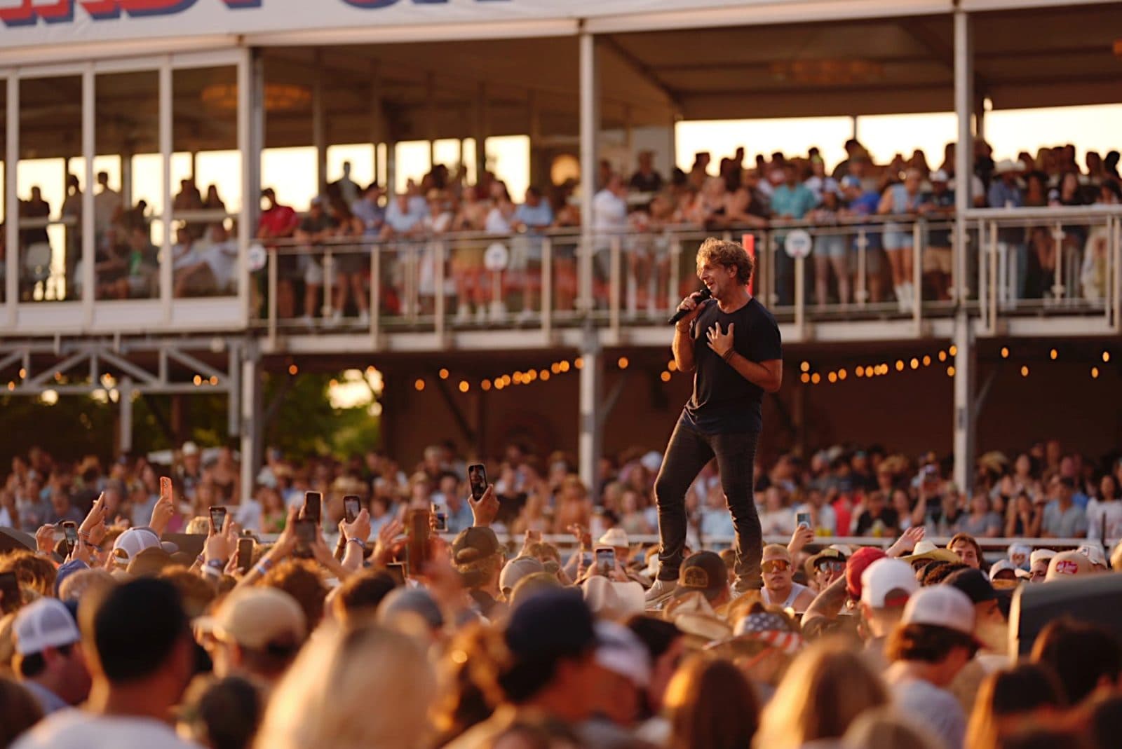a large single beef rib being held up in the air